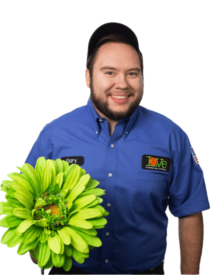 Love Plumbing Air & Electrican employee holding a green flower